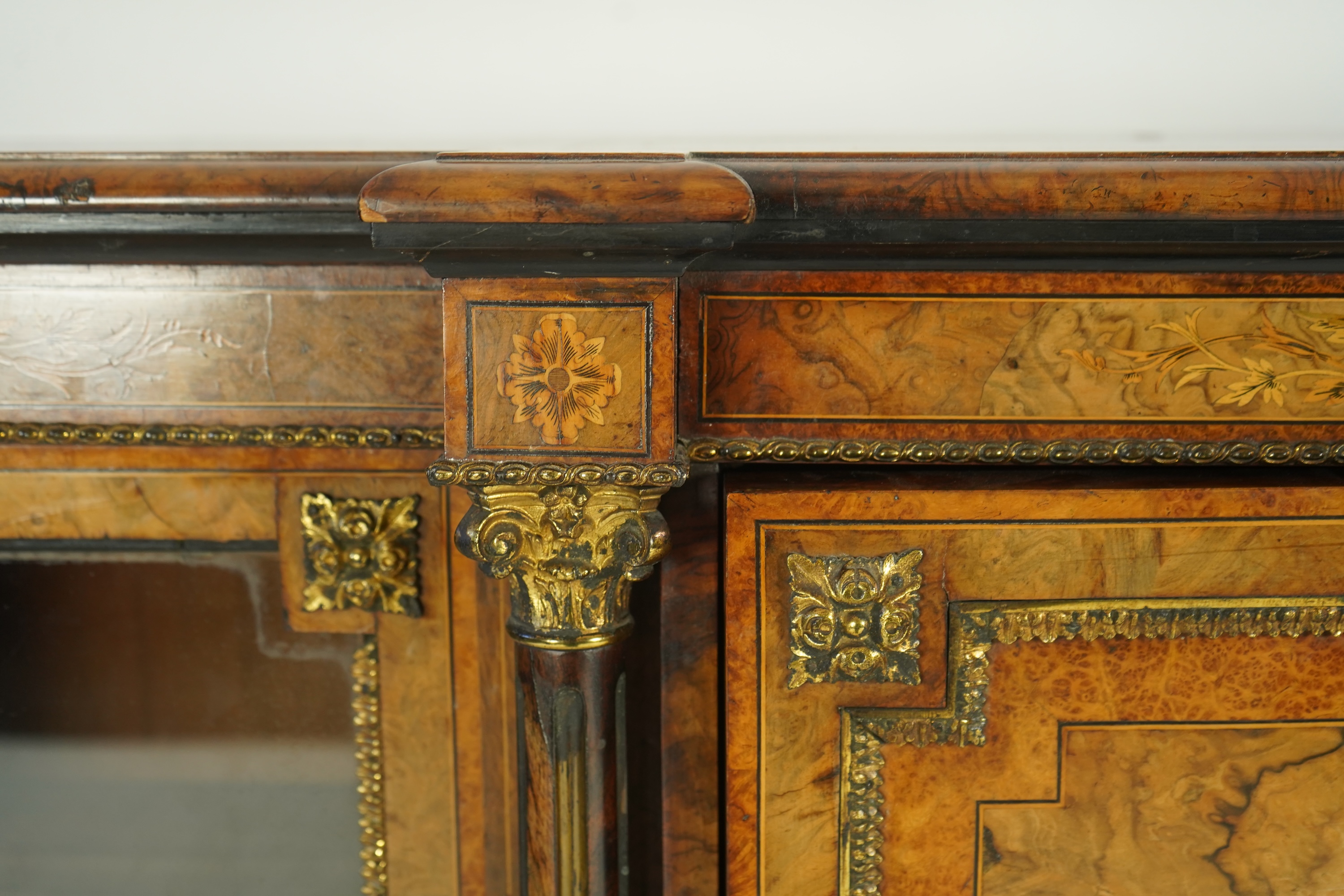 A Victorian birds eye maple banded, gilt metal mounted figured walnut side cabinet